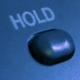 Telephone hold button