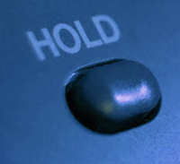 Telephone hold button